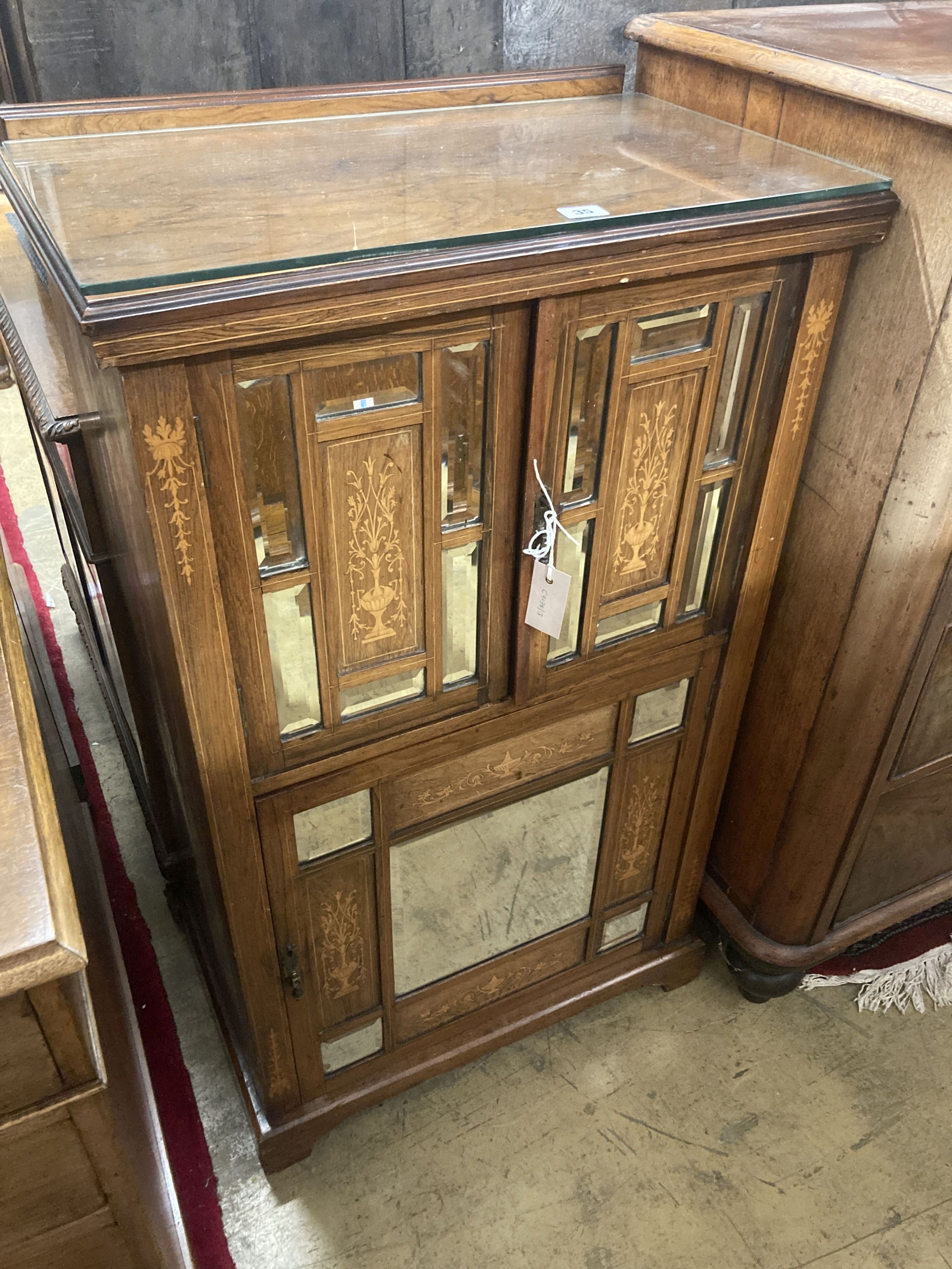 A late Victorian inlaid rosewood mirrored music cabinet, width 61cm, depth 38cm, height 105cm